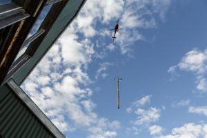 Industrial Photography Hobart- Helicopter pole install